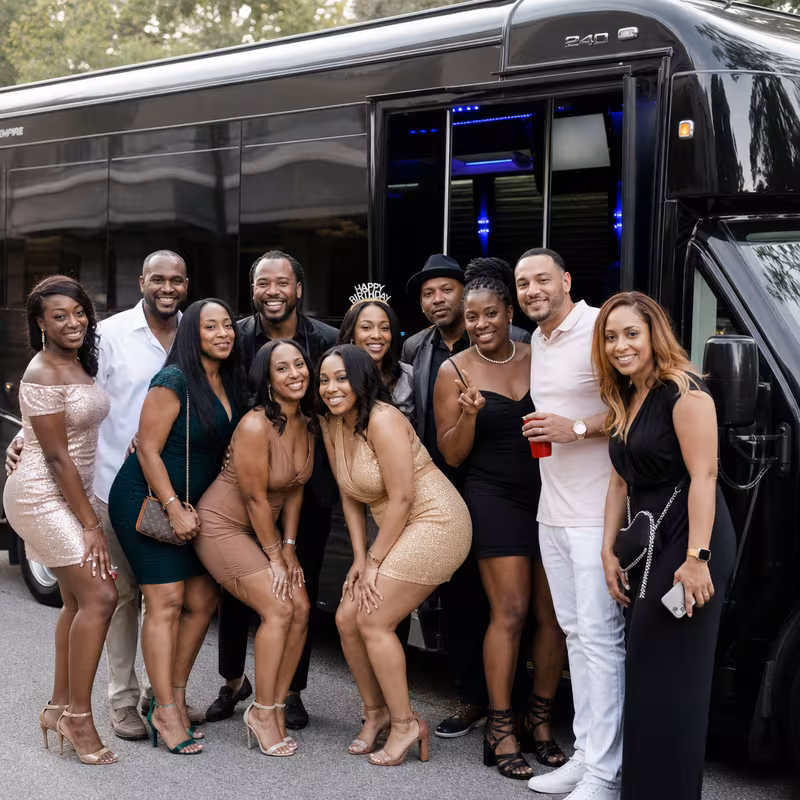 Party bus interior with wraparound leather seating and LED lighting in Plano