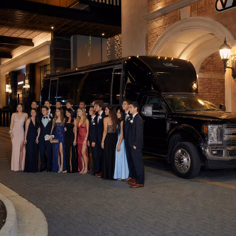 Party bus interior with wraparound leather seating and LED lighting in Plano