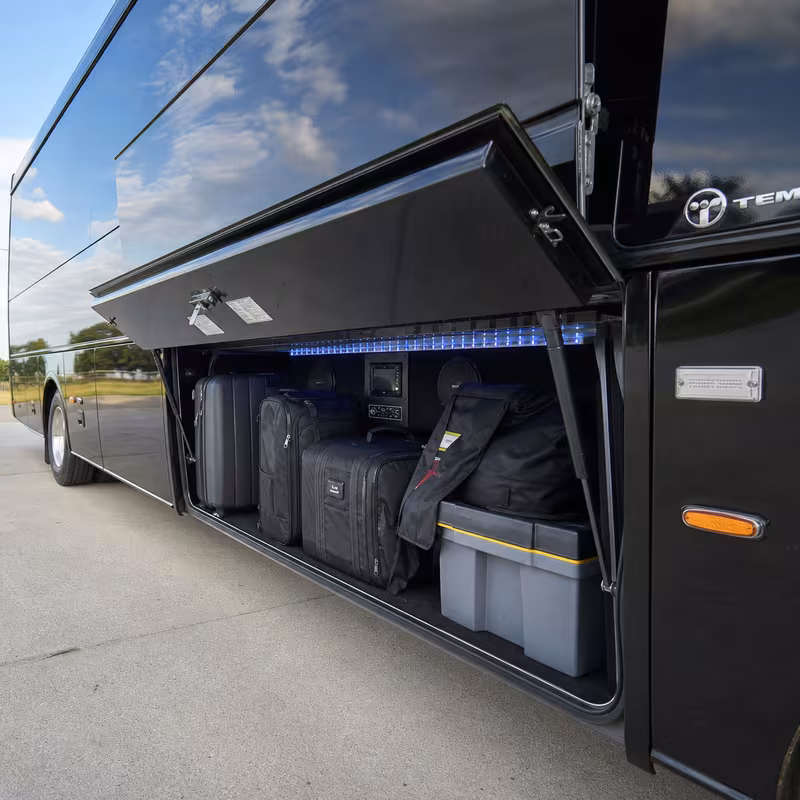 Party bus interior with wraparound leather seating and LED lighting in Plano