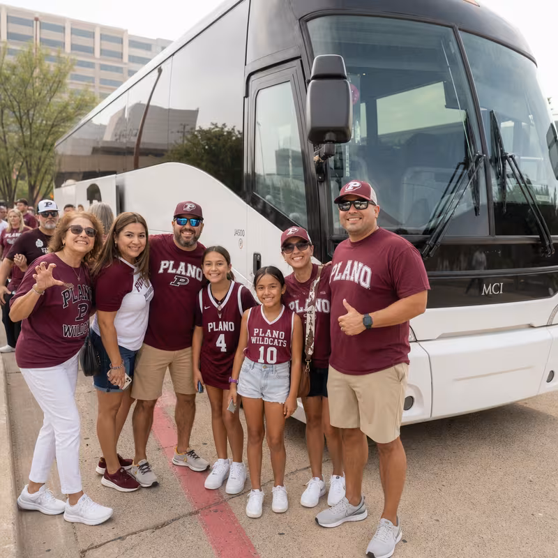 Passengers loading luggage while boarding an Plano group shuttle
