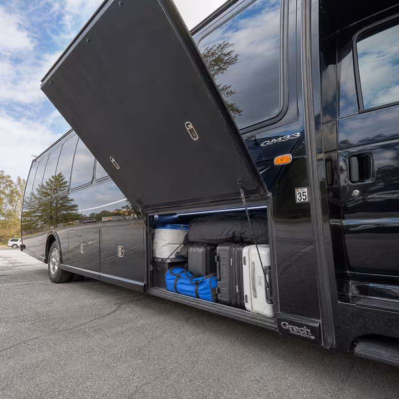 Party bus interior with wraparound leather seating and LED lighting in Plano